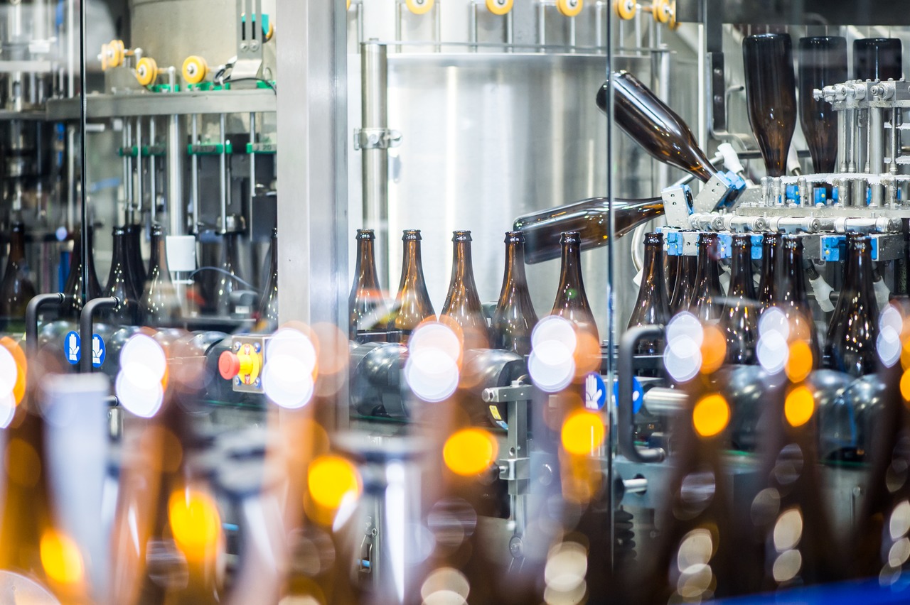 Before filling new bottles, they are being cleaned by a rinser. 